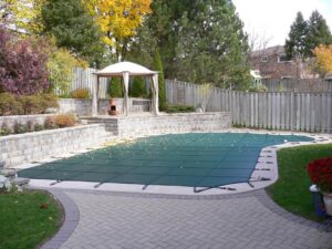 Safety cover for swimming pools