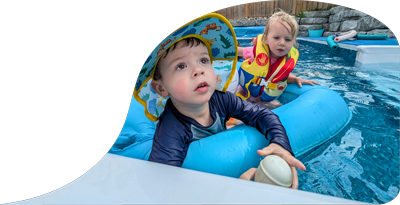 Kids swimming in a pool lined by Summertime Pool Services.