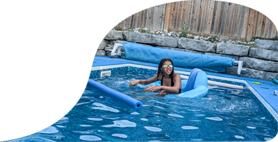 Client swimming in pool treated by Summertime Pool Services